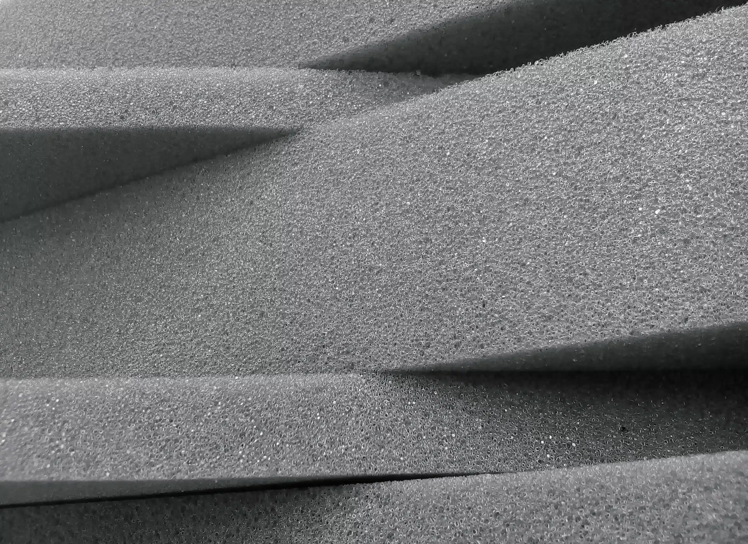 Stacked foam sheets of varying thickness