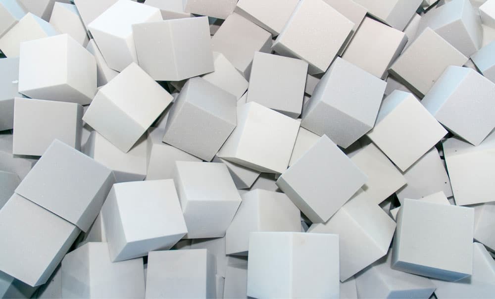 Gray foam cubes cut with CNC blades