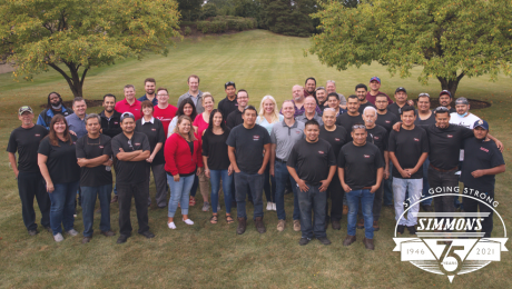 Simmons' employees pose for a picture at 75th-anniversary celebration.