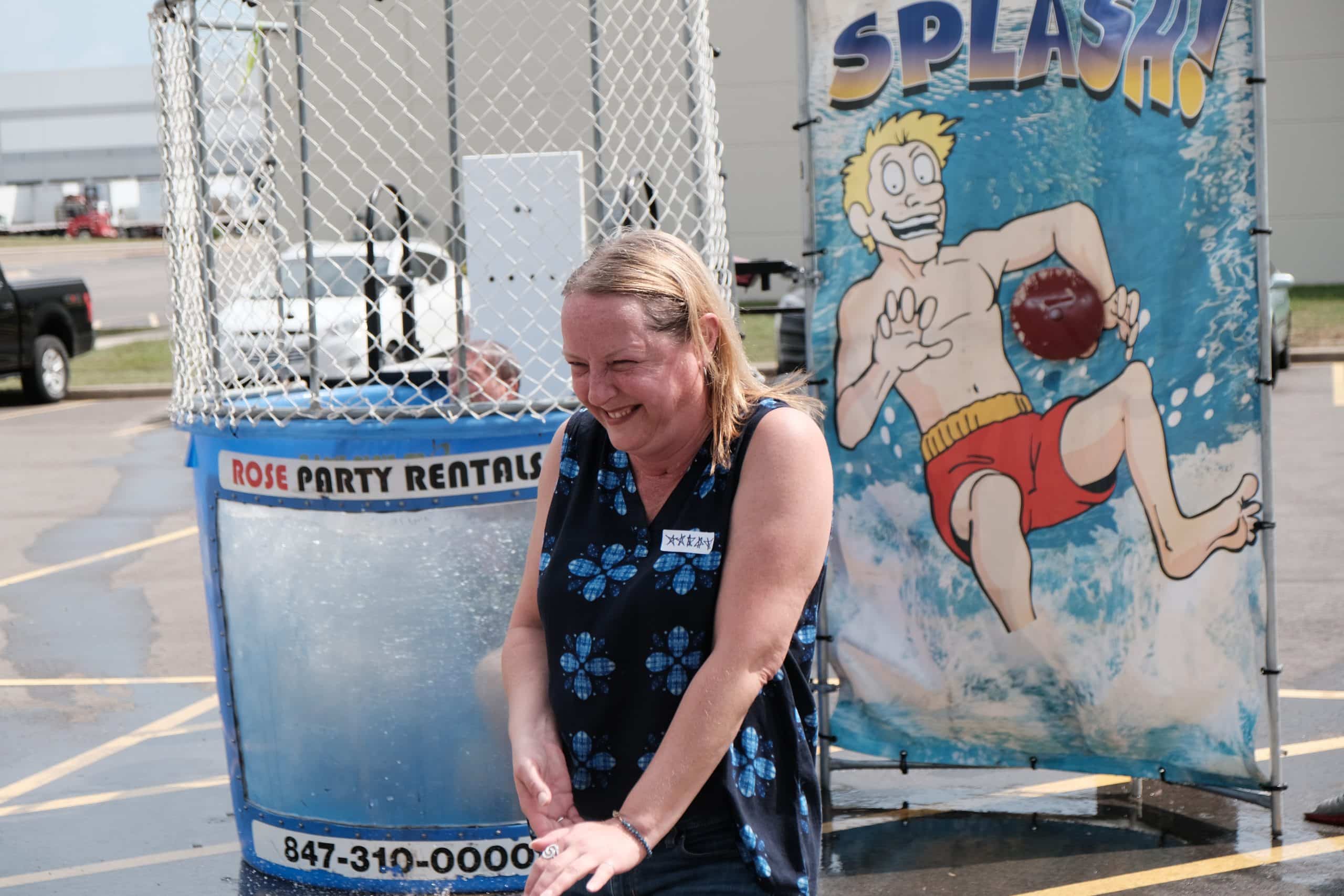 Simmons' Lisa Lucietto laughs after dunking Production Manager.