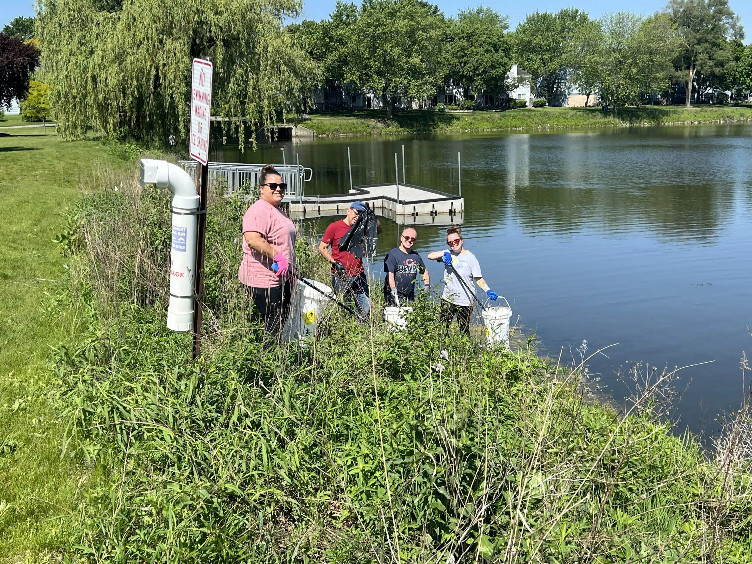 Simmons' employees cleaning up Westlake Park in Bloomingdale, IL.